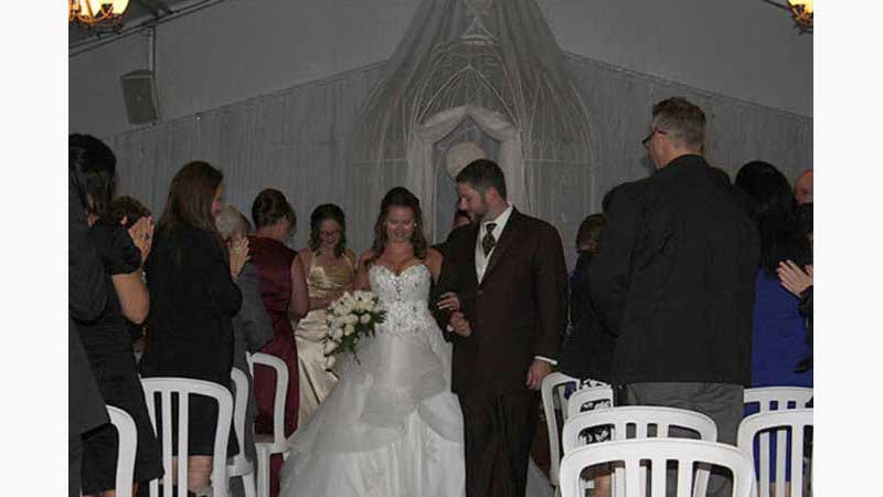 From Wedding 5, DJ Oshawa, Bride and Groom walking down the aisle after ceremony, guests in background. Taken in Oshawa Ontario